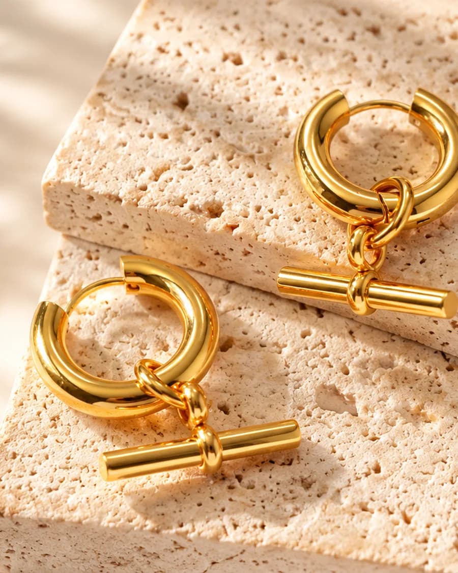 Talia Hoops photographed on a travertine block in warm daylight