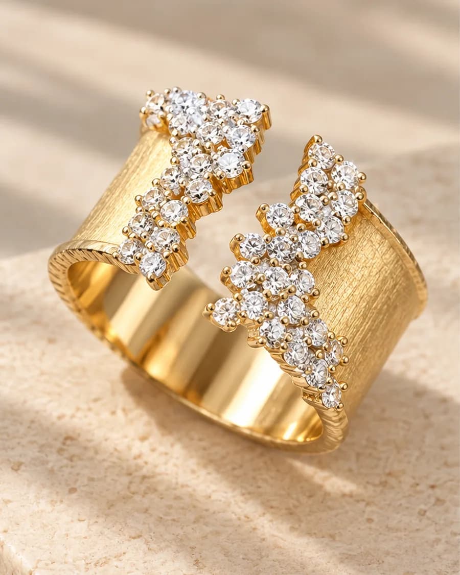 The Fleur Éclat Ring photographed on a travertine block in warm daylight