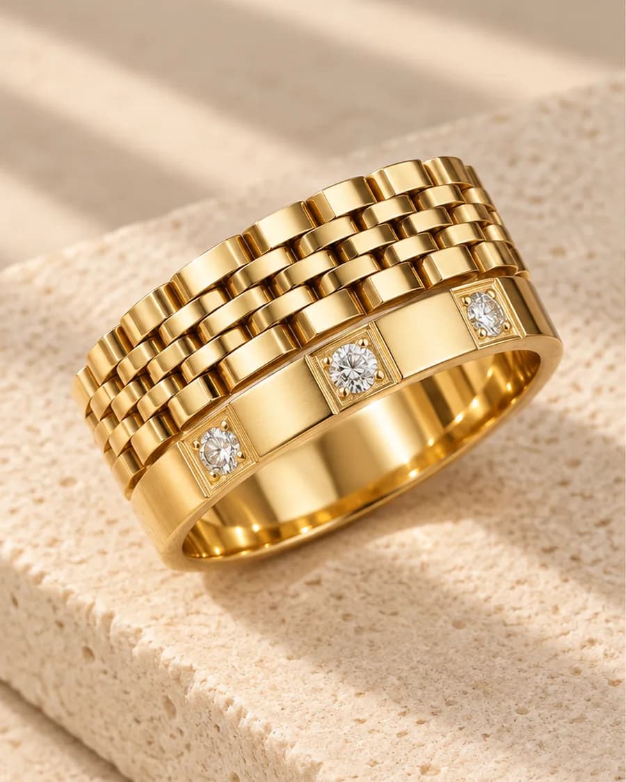 The Heritage Link Ring photographed on a travertine block in warm daylight