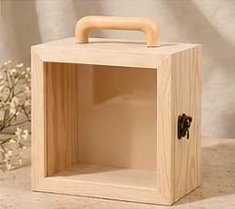 A glass-fronted pine SÉVRA gift box with a wooden handle and brass catch