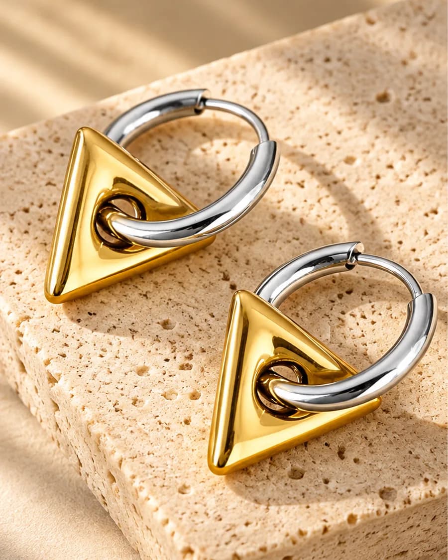 Nova Hoops photographed on a travertine block in warm daylight