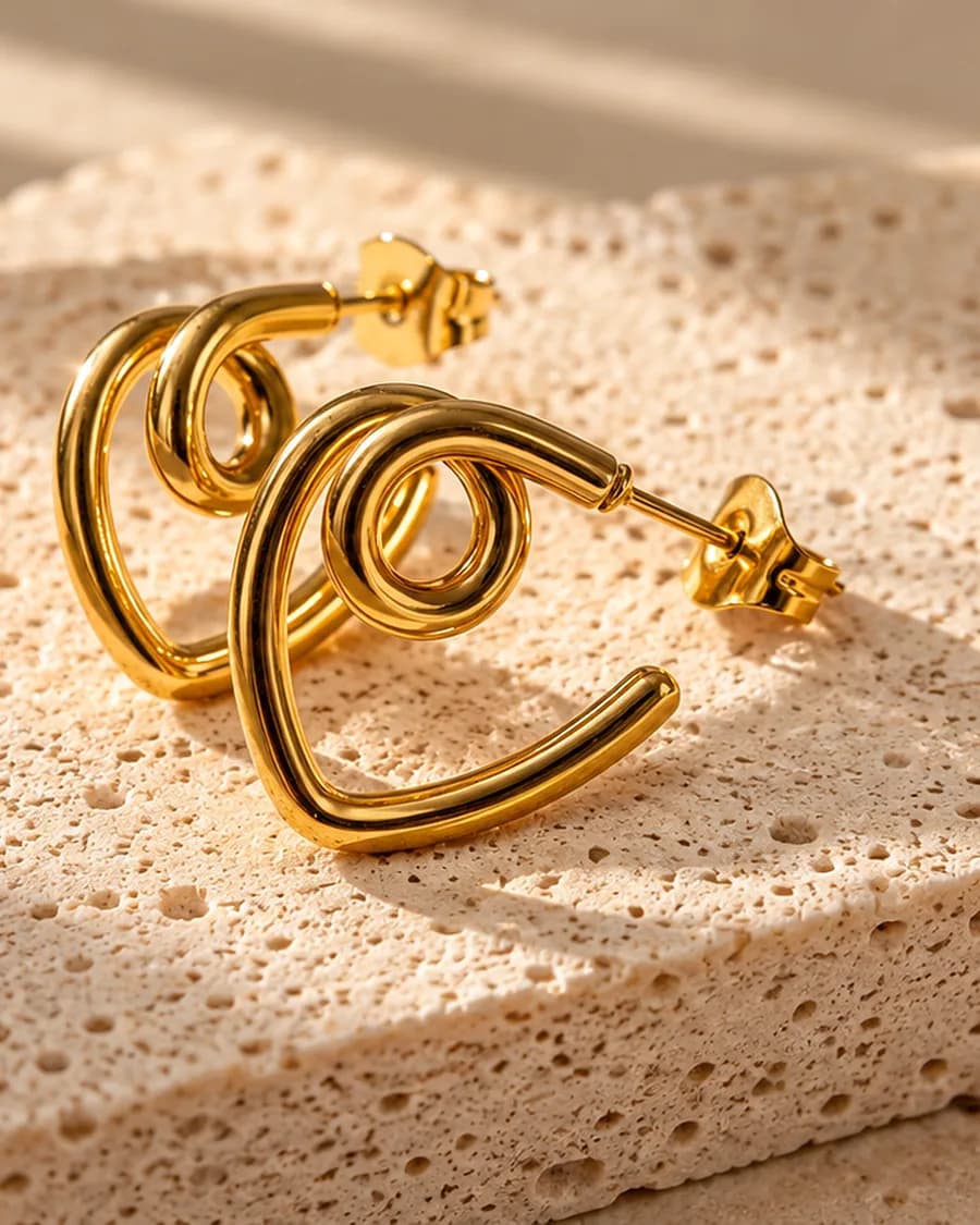 Orbit Hoops photographed on a travertine block in warm daylight