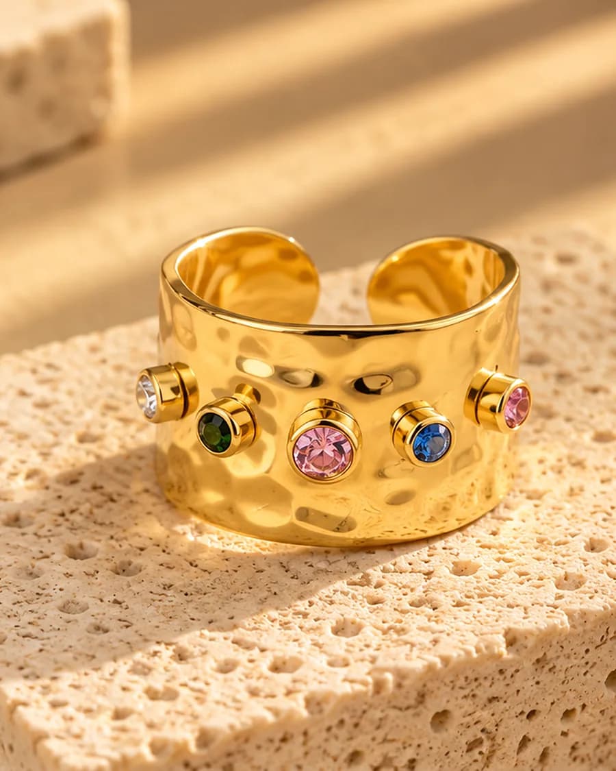 The Gemma Ring photographed on a travertine block in warm daylight