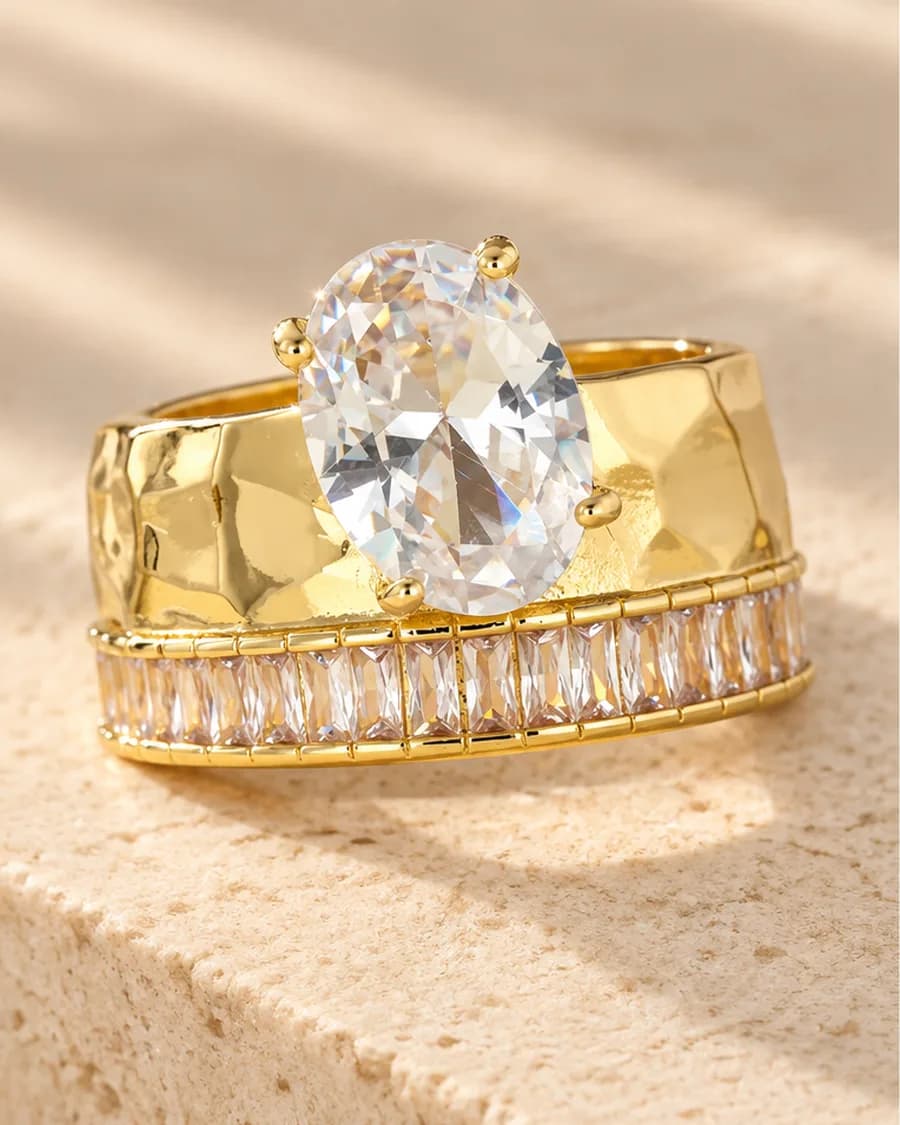 The Grande Lumière Ring photographed on a travertine block in warm daylight