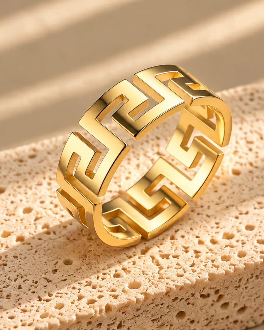 The Meander Ring photographed on a travertine block in warm daylight