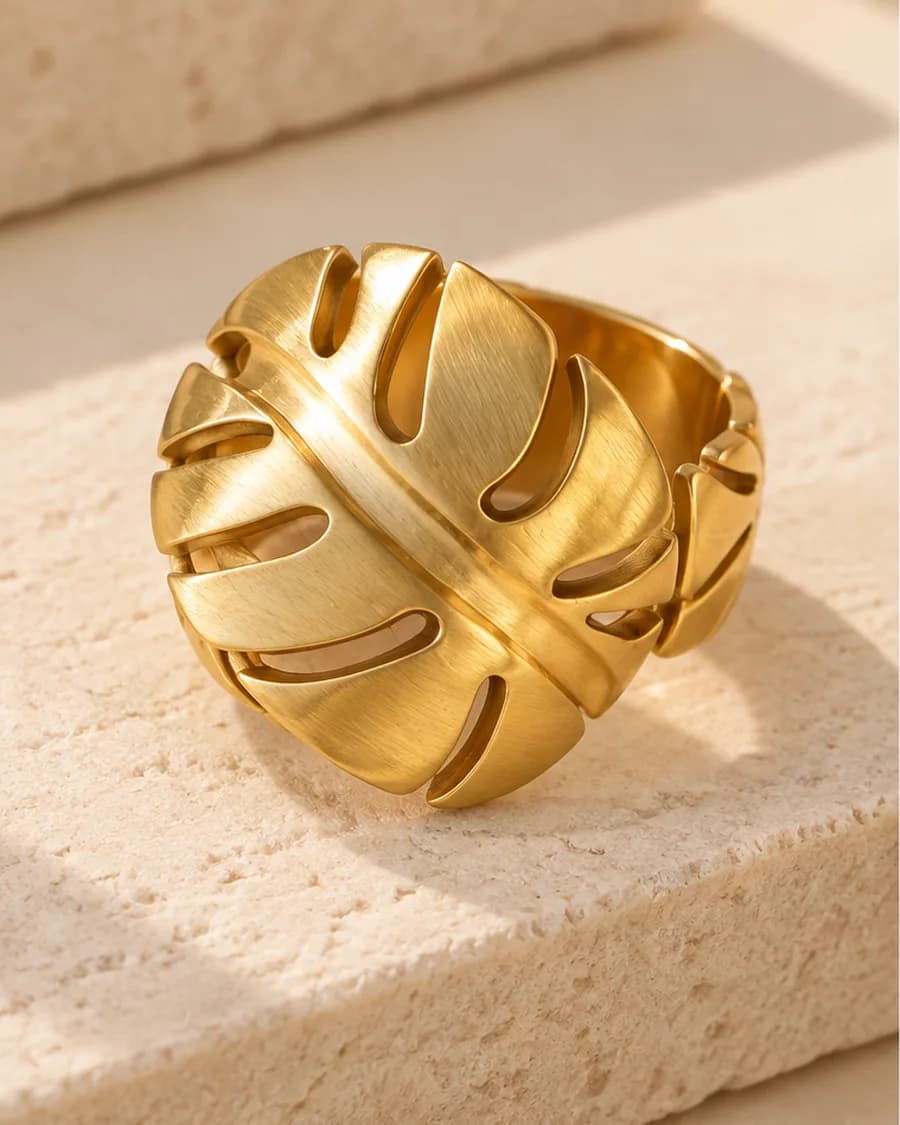 The Monstera Ring photographed on a travertine block in warm daylight