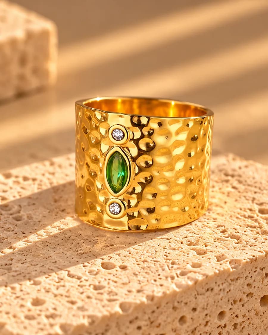 The Oasis Ring photographed on a travertine block in warm daylight