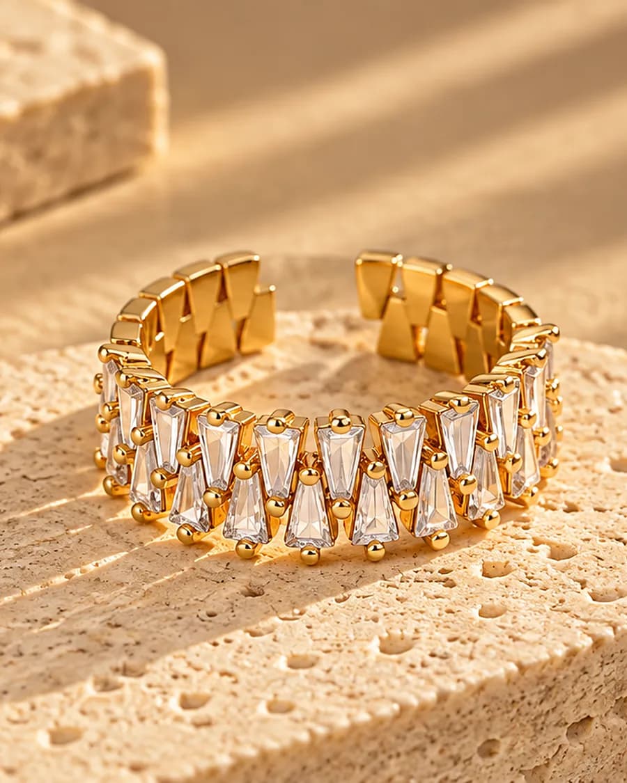The Radiance Ring photographed on a travertine block in warm daylight