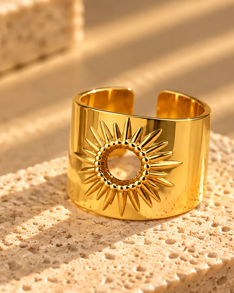 The Sunburst Ring photographed on a travertine block in warm daylight